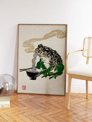 Japanese Ukiyo-e style frog eating ramen noodles with chopsticks in a black bowl, steam rising, on a textured beige background. - Image 2