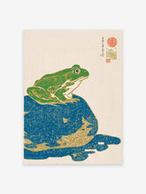 Japanese woodblock print style frog wall art, a green frog on a blue rock with gold accents and traditional calligraphy.