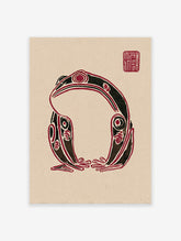 Stylized black and red frog wall art print in an indigenous folk art style on a beige background with a red seal.