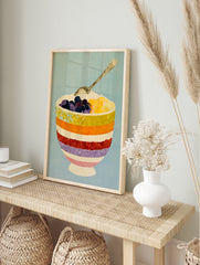 Illustrative art print of a striped bowl filled with berries and fruit, with a silver spoon, in an alternate framed mockup