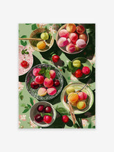 Vibrant fruit wall art illustration showing colorful plums and cherries in bowls on a green floral tablecloth, top-down view.