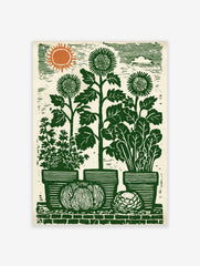 Green lino-cut style garden harvest print with sunflowers, potted herbs, pumpkin, and orange sun