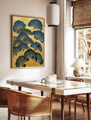 Illustrative ginkgo leaf botanical print in blue and green on a textured golden background, in a styled room mockup