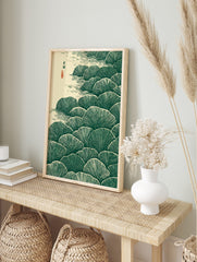Stylised dark green ginkgo leaves in layers with beige water ripples and Japanese calligraphy, in an alternate framed mockup