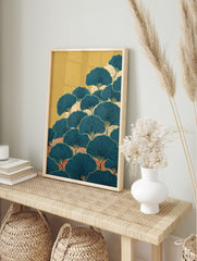 Stylised teal ginkgo leaves wall art with black veins and golden stems, layered over cream, in an alternate framed mockup