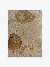 Textured gold botanical wall art featuring abstract leaf patterns with shimmering metallic lines on a neutral beige background.