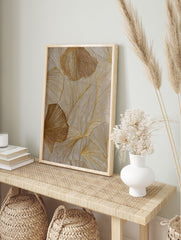 Textured gold botanical wall art featuring abstract leaf patterns with shimmering metallic lines on a neutral beige background. - Image 3