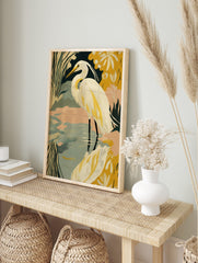 Illustrative print of a white great egret in water with green and yellow stylised foliage, in an alternate framed mockup