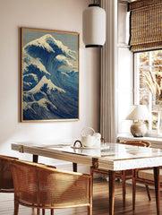 Japanese Great Wave wall art print with powerful blue ocean waves, white foam, and a small mountain, in a styled room mockup