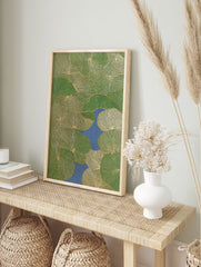 Green lily pad botanical wall art with golden line details floating on blue water, seen from above, modern nature print. - Image 3