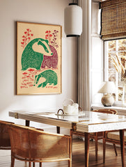 Illustrative print of two badgers with green and maroon bodies, red foliage, on a beige background, in a styled room mockup