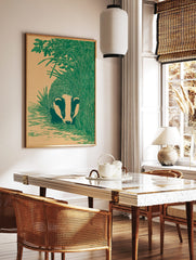 Illustrative green badger peeking from tall grass and foliage on a beige background, portrait, in a styled room mockup