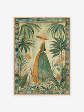 Green botanical wall art featuring a woman in a hat in a tropical garden with palm trees and flowers, framed.