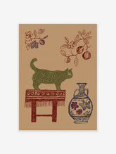 Green cat wall art illustration on a brown background, with a red stool, blue vase, and botanical branches.