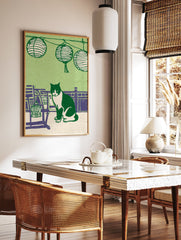 Illustrative green cat print featuring a black and white tuxedo cat sitting among purple furniture and Japanese lanterns. - Image 2