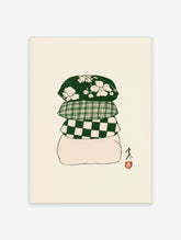 Green cushion stack poster with floral, plaid, and checkerboard cushions on cream background