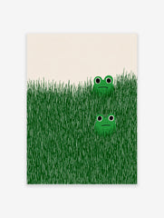 Illustrative green frog wall art print showing two cartoon frogs peeking from tall green grass on a light background.