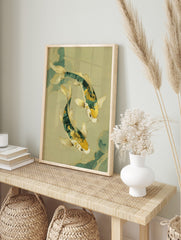 Illustrative print of two green and gold koi fish swimming gracefully on a light green, in an alternate framed mockup