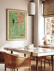 Stylised green parrot on red branch, surrounded by green jungle vines, red leaves, and a patterned, in a styled room mockup
