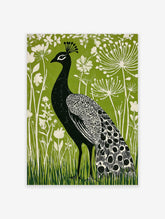 Black peacock with white patterned feathers against a vibrant green background with white botanical flowers and grass