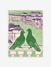 Green pigeon wall art featuring two pigeons on a balcony overlooking a city with purple-roofed buildings