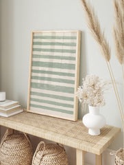 Green and white horizontal striped abstract wall art with hand-drawn texture on satin paper, in an alternate framed mockup