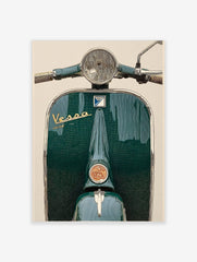 Close-up of a dark green vintage Vespa scooter front, with chrome headlight and gold Vespa script