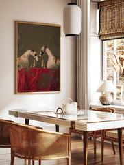 Two greyhounds playing chess by candlelight on a red table, with pine branches, against a green, in a styled room mockup