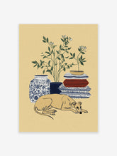 Greyhound wall art print of a sleeping dog with botanical plant, blue vase, and patterned blankets.