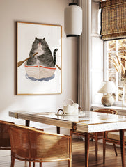 Watercolor illustration of a grumpy fat cat in a small rowing boat on a white background, in a styled room mockup