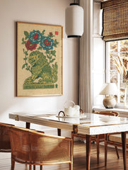 Green and gold guardian lion with red and blue peony flowers, illustrative folk art print on beige, in a styled room mockup