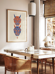Vertical Hannya mask wall art featuring two Japanese demon masks in red and blue on a textured, in a styled room mockup