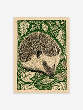 Hedgehog linocut style wall art print with green foliage on a cream background, portrait orientation