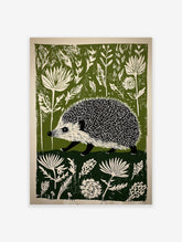 Green and off-white linocut style print of a hedgehog walking through dense botanical foliage.