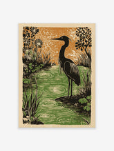 Illustrative woodcut print of a dark heron in a green pond with ripples, surrounded by black foliage against an orange sky