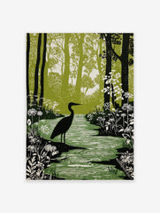 Linocut-style print of a black heron standing in a green forest stream with white flowers and tall trees
