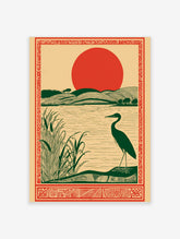 Illustrative art print of a dark green heron by a lake with reeds, rolling green hills, and a large red sun, within an