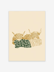 Illustrative art print of two golden Highland cows, one with a green floral blanket, on a beige background