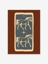 Two cream horses facing opposite directions on a blue background with star motifs and a brown border