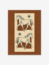 Navy line drawing of two horses with eight-point stars on a cream panel over a brown background