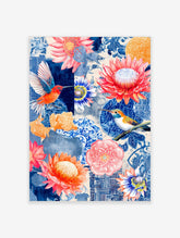 Vibrant blue and orange botanical collage wall art with two hummingbirds and tropical flowers