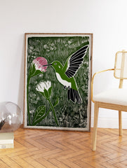 Green linocut print of a hummingbird with a pink flower, white flower, and foliage. - Image 2