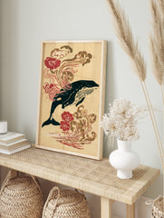 Humpback whale illustration in Japanese woodblock style with red flowers and wave patterns on, in an alternate framed mockup