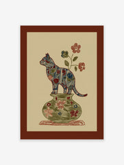 Folk art style illustration of a multi-color patterned cat standing on a green floral vase with flowers on a beige background.