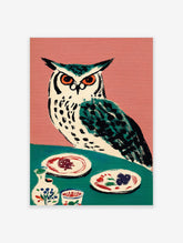 Illustrative owl with orange eyes on teal table with plates and pottery, pink background, folk art style