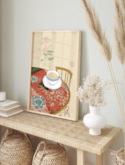 Illustrative wall art of a tea cup and saucer on a patterned red tablecloth with botanical background - Image 3