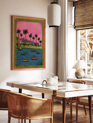 Colorful Indian cityscape wall art with buildings, palm trees, and boats on blue water under a pink sky, ornate border. - Image 3