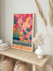 Colourful Islamic architecture wall art with mosques, minarets, palm trees, and Arabic, in an alternate framed mockup