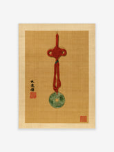 Jade bi pendant with red knot and calligraphy on tan textured background