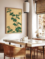 Japanese botanical art print featuring green leaves and orange berries on a tan background, in a styled room mockup